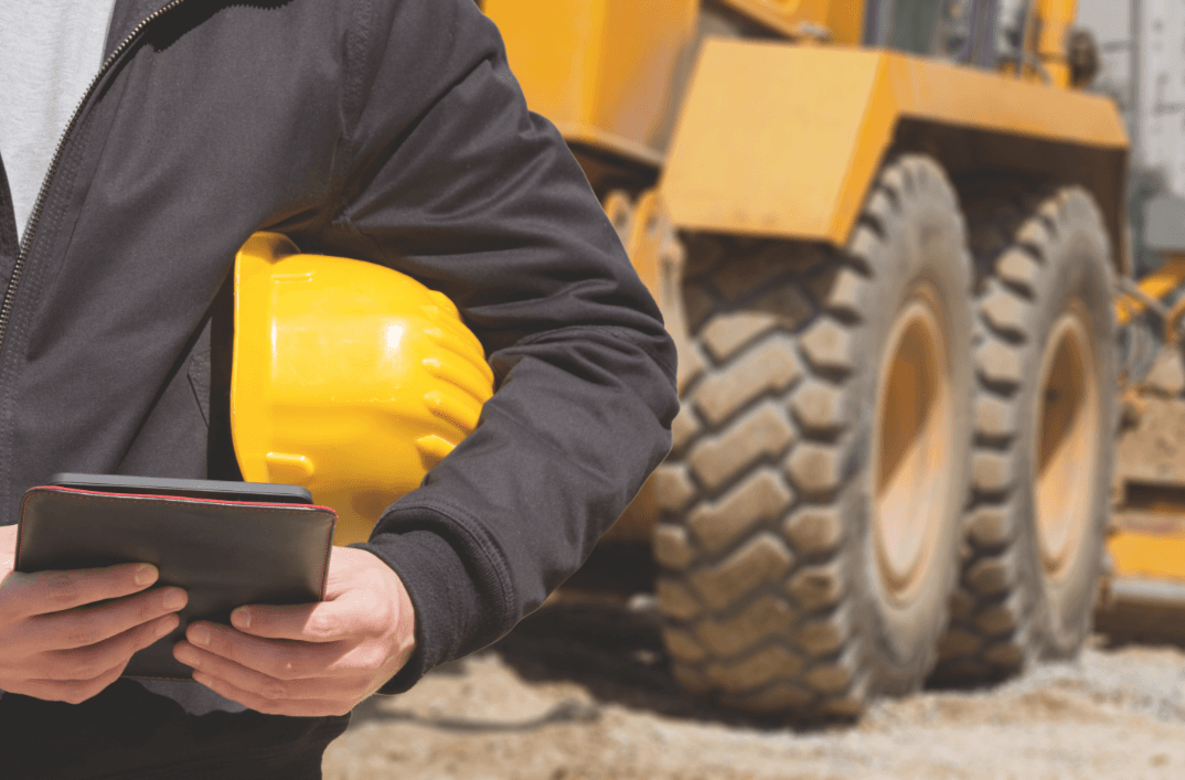 construction worker holding a tablet